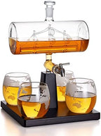 Ship decanter with a set of glasses.